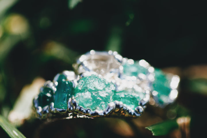 New Beginnings · Emerald and Quartz Ring